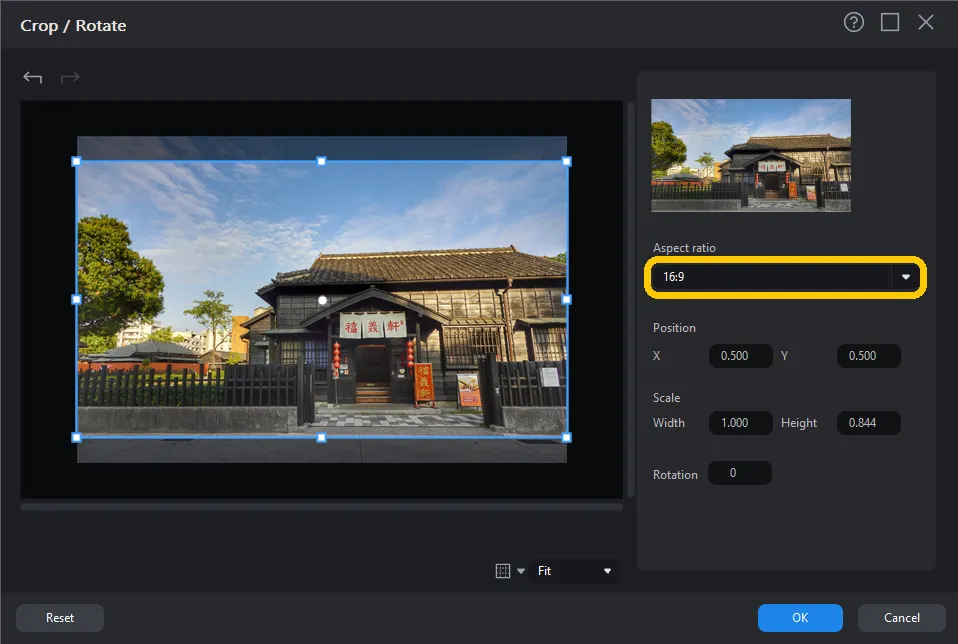 The Crop / Rotate window with the Aspect ratio dropdown set to 16:9 and the crop frame over a photo of a traditional wooden building.