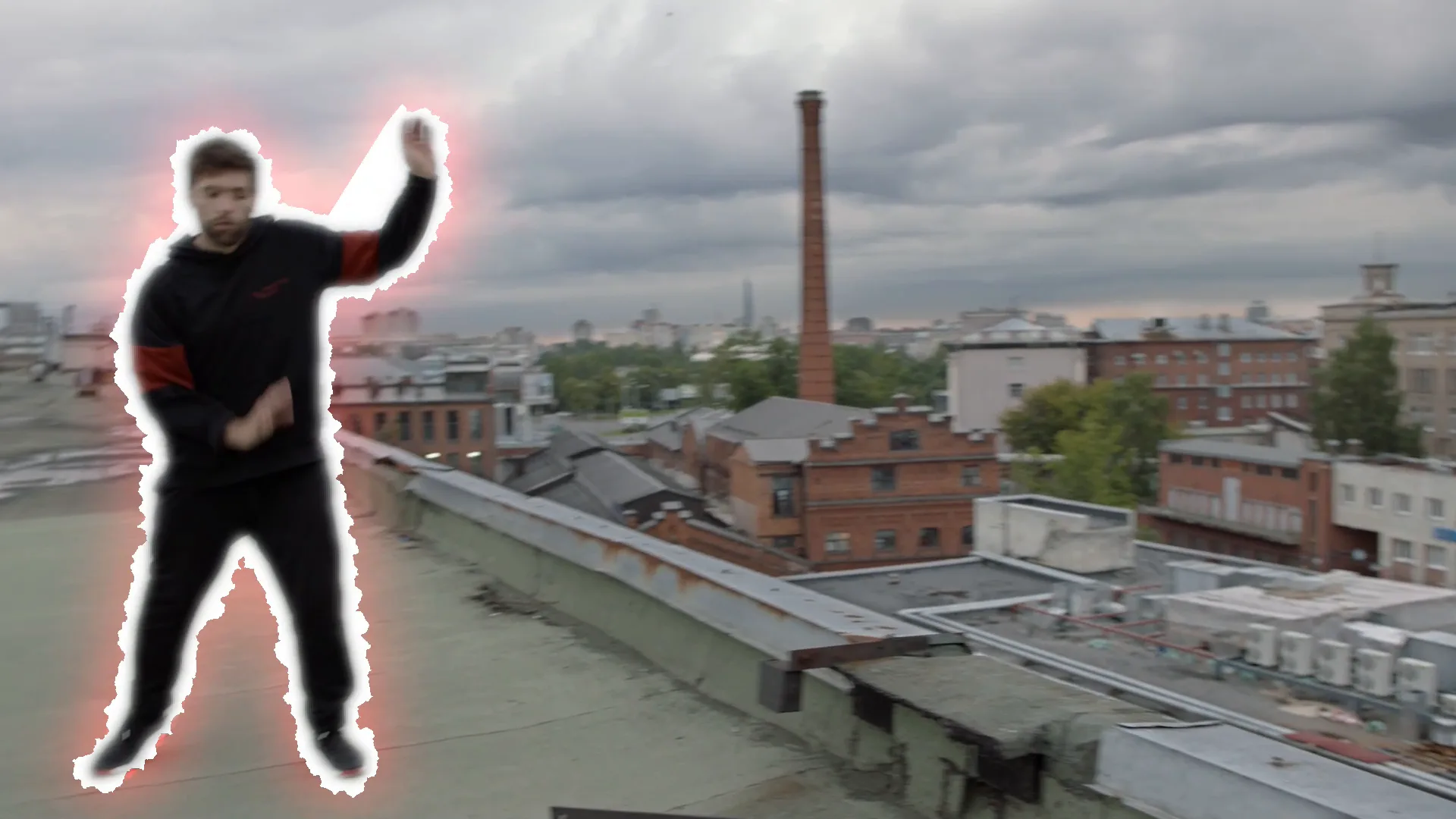 A frame from the finished clip: the dancer reaching up with the glowing outline around the whole body