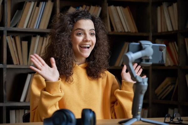 woman smiling in front of a camera