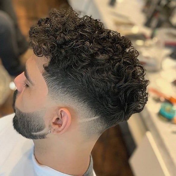 Short curly taper haircut for men