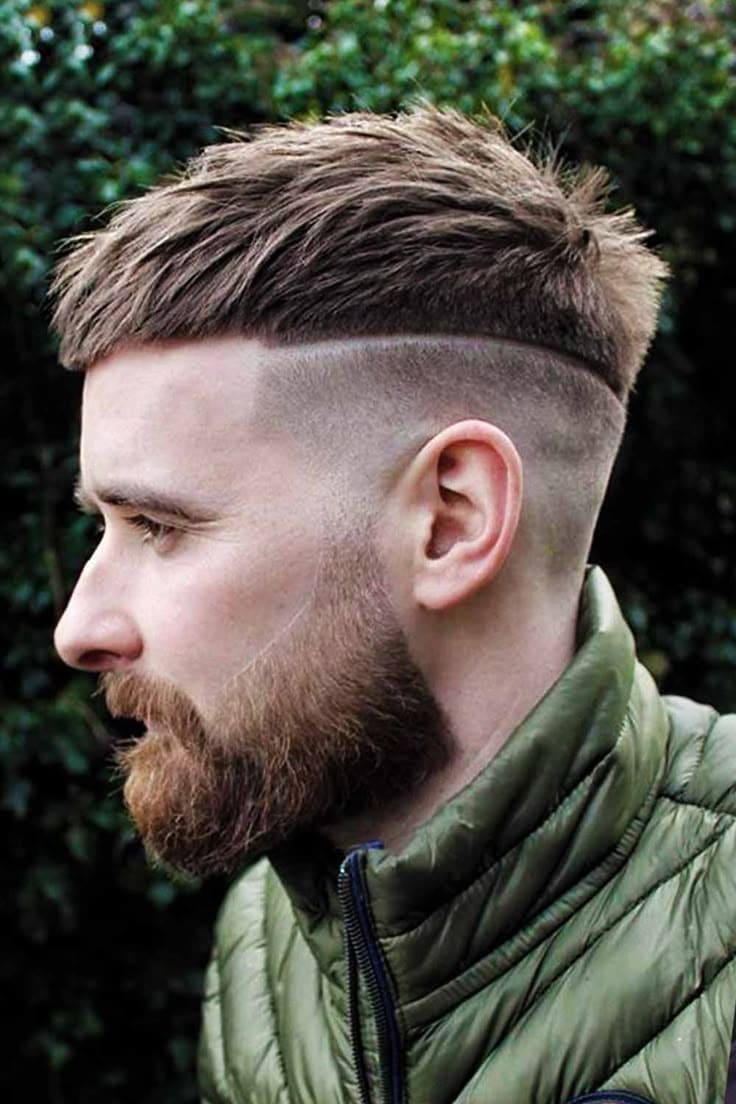 Disconnected crop fade haircut with bold contrast for men