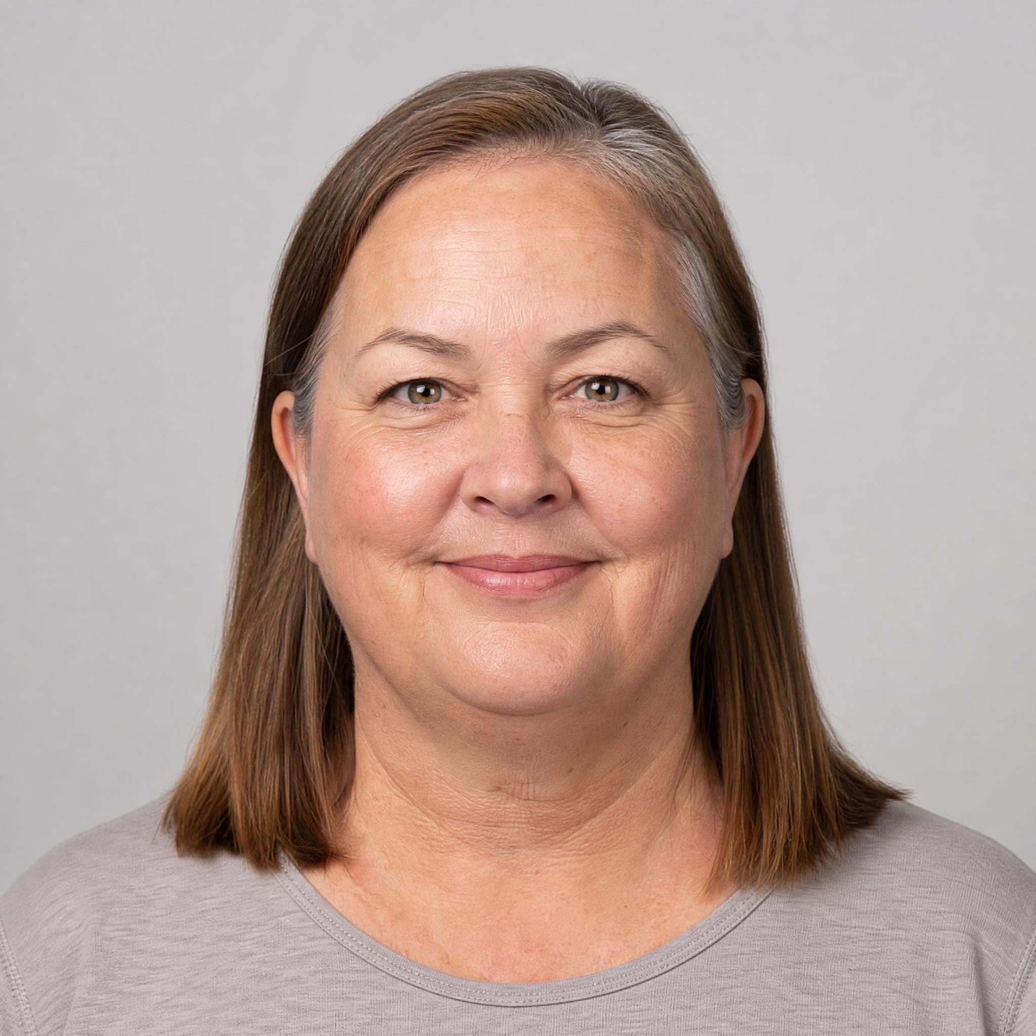 Base portrait with a round face shape and long unlayered hair, before any styling change