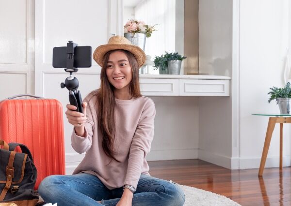 woman smiling in front of a camera