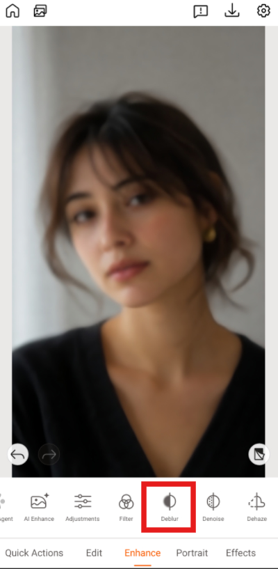 use PhotoDirector to restore an old photo of a woman with Deblur feature