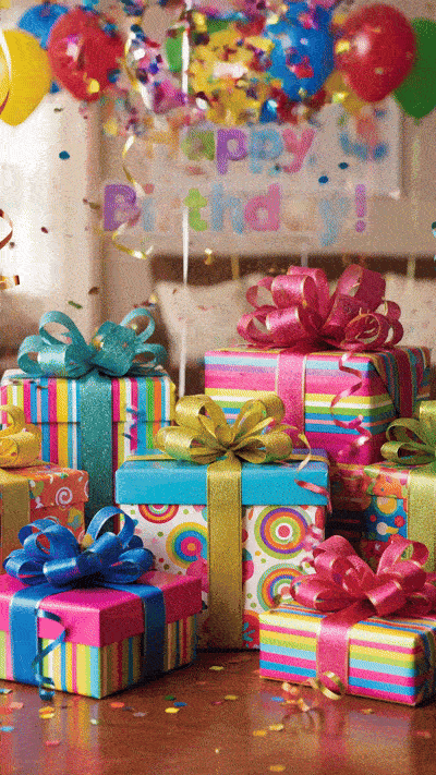Geburtstags-GIF: 'Bunte Geschenkboxen, schwebende Luftballons und tanzender Konfetti. Der Text Happy Birthday! erscheint in fröhlicher, bunter Schrift mit Glitzer-Effekt und springt leicht beim Einblenden.'