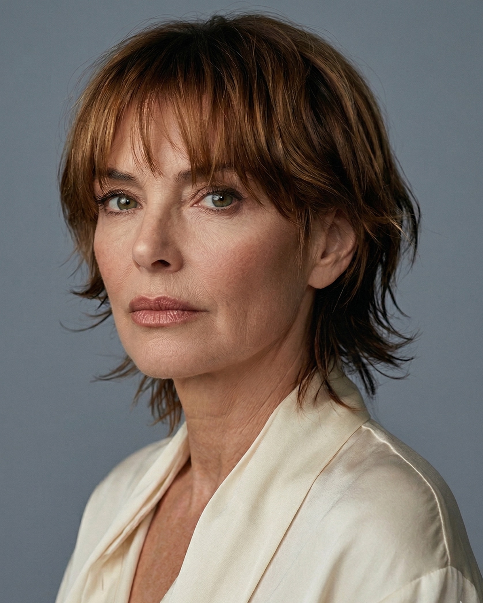 Haircut for women over 50 years old - Layered Mid-Length Hair