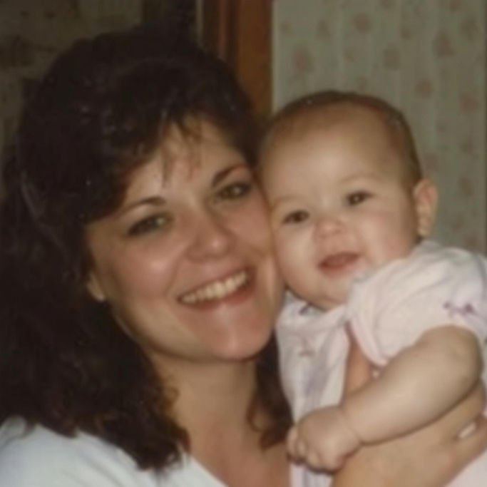 an old photo, fraturing mom holding her baby