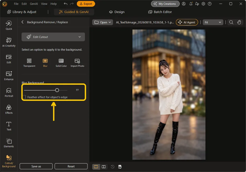 The Blur Background slider and the Feather effect checkbox highlighted, the street behind the subject out of focus