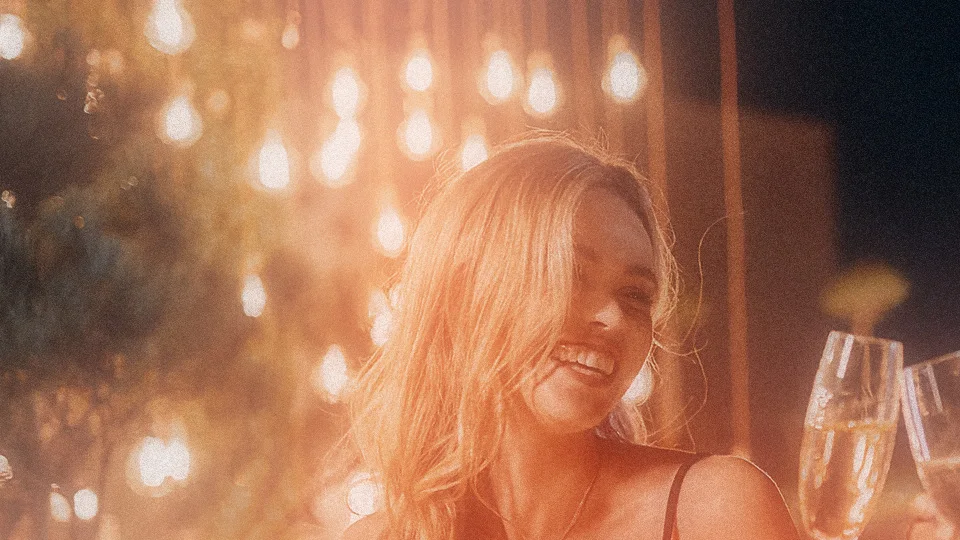 The same close-up with Black Mist, a warm glow around each light and softer highlights on her face and hair