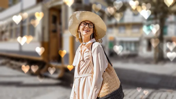 The same bokeh with heart-shaped lights in the blurred background behind the woman