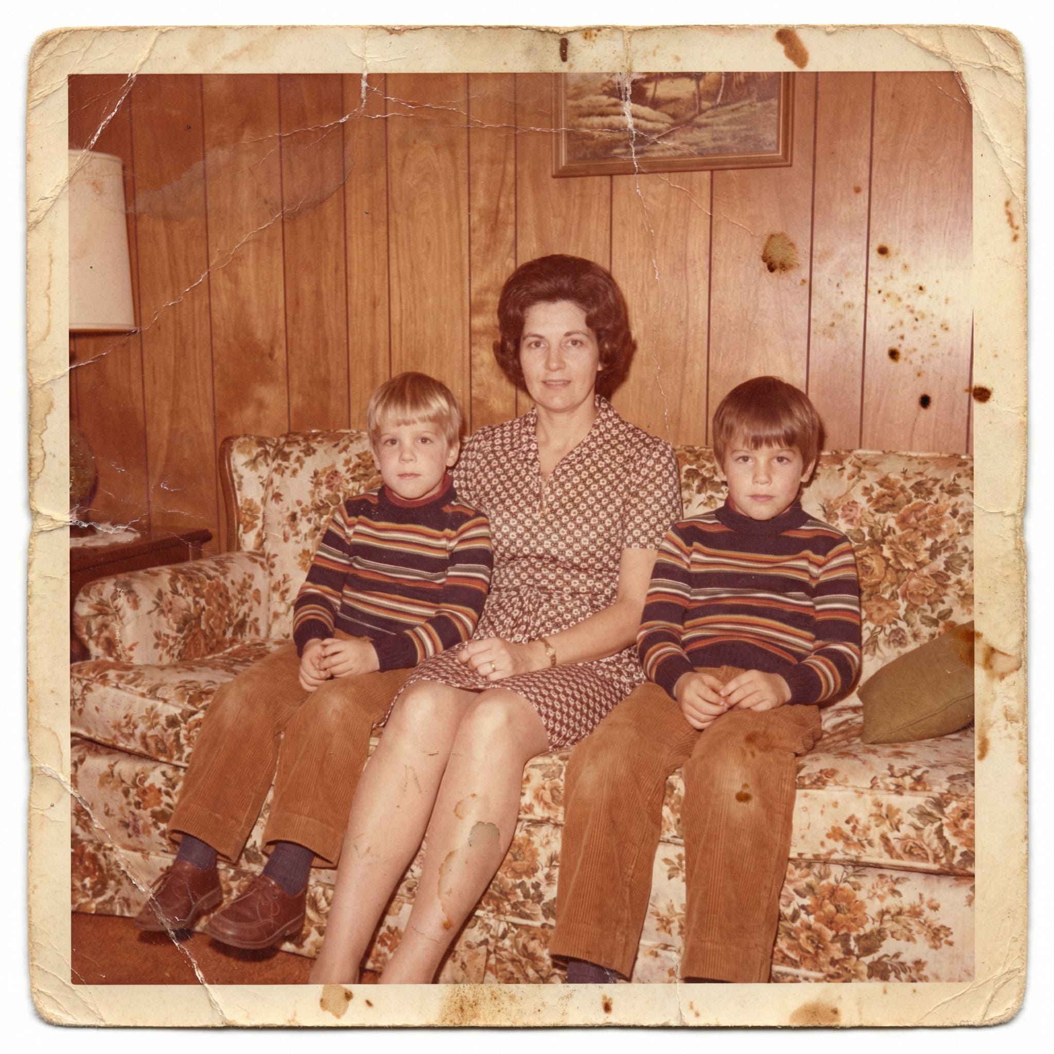 Faded old family photo before AI restoration